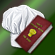 Chef hat and cookbook.png